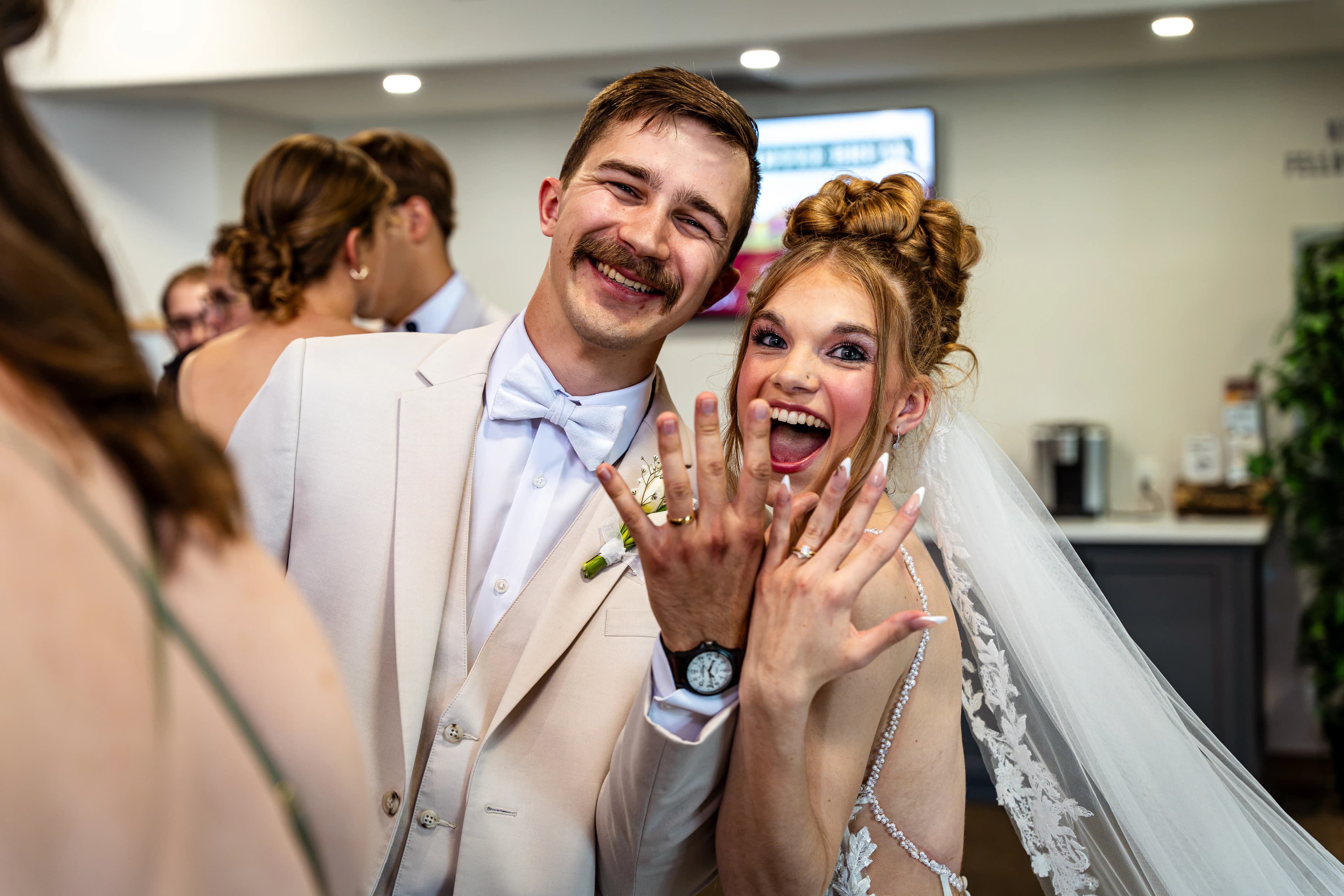 Wedding rings and hands held together